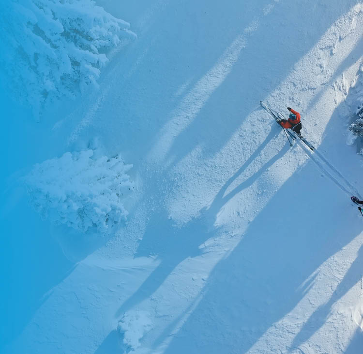 a young family in front of a countryside cottage
