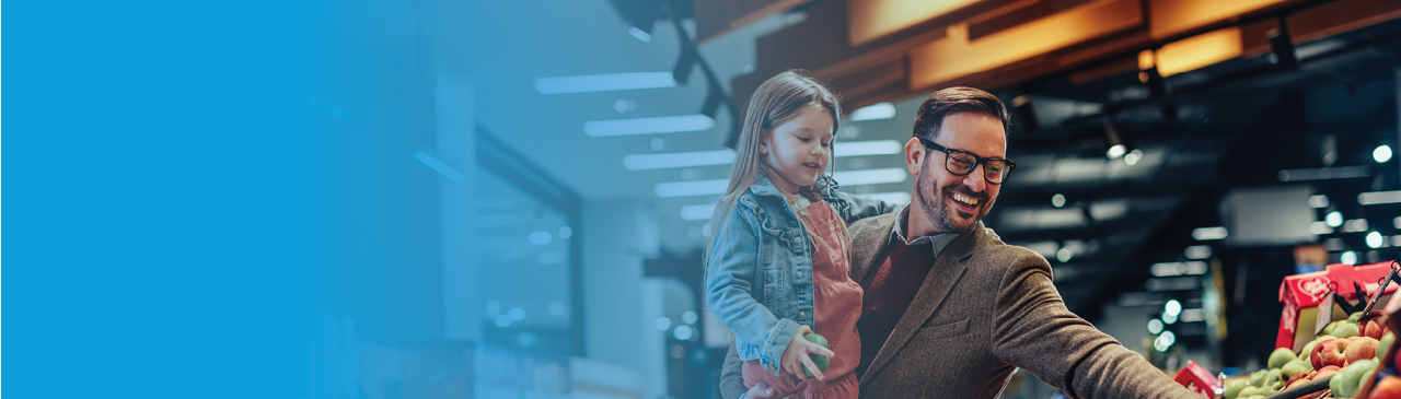 a young family in front of a countryside cottage