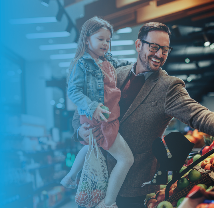 a young family in front of a countryside cottage